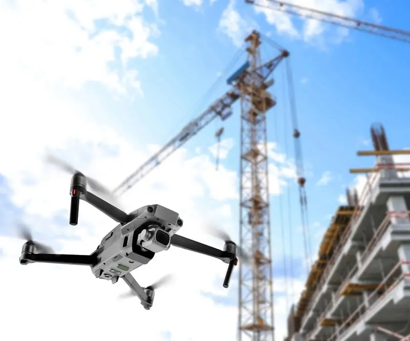 a rhode island drone photographer using his drone on a construction site for inspections
