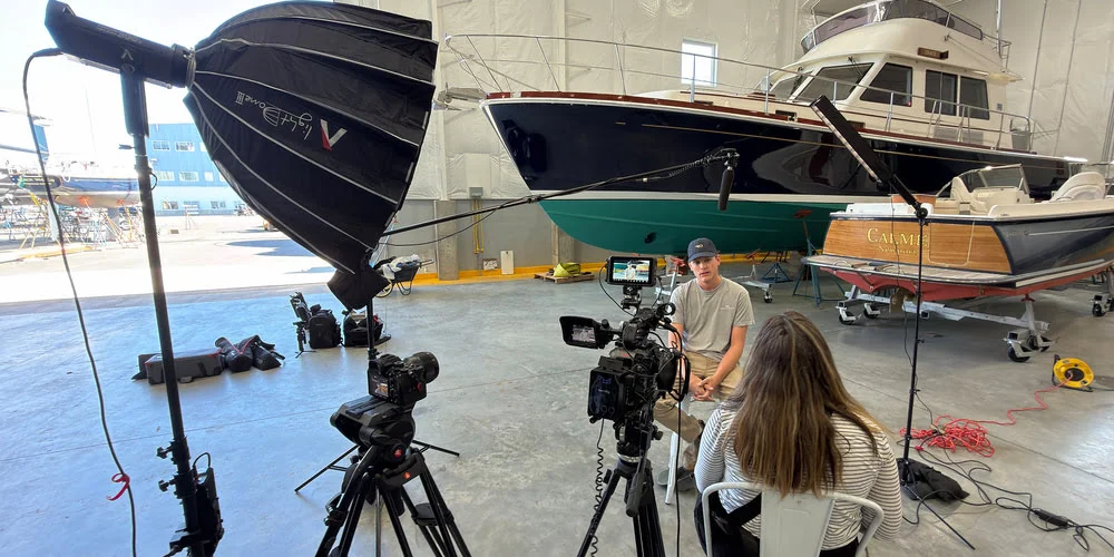 Video production crew filming an interview for emotional storytelling and authentic video content