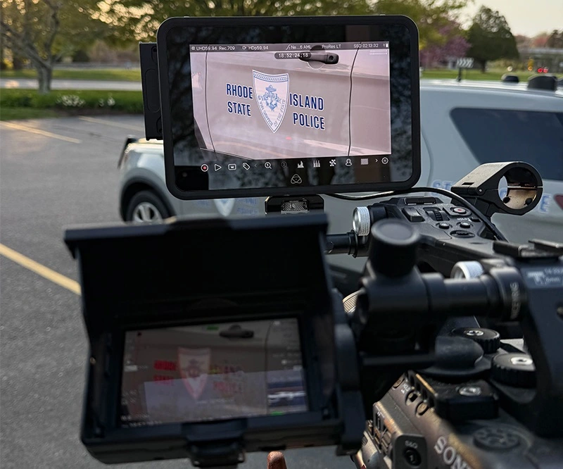 A Rhode Island videographer at a video shoot for a local law firm